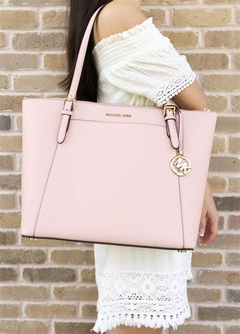 michael kors pink purse with a bow|Michael Kors pink suitcase.